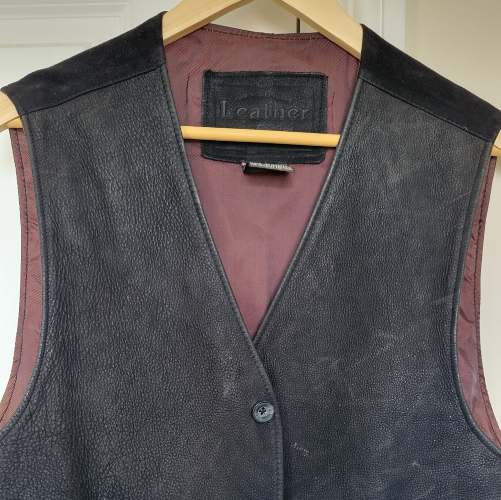 Men's casual leather vest.  Has some scratches but is still in good condition.